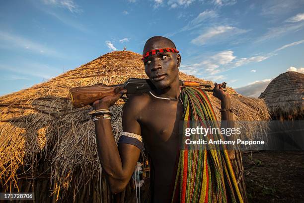 Warrior boy of the Mursi tribe in the mursi village in the mago national park. The Mursi tribe They are nomadic cattle herders live in the lower Omo...