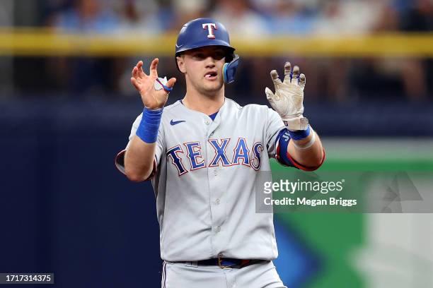 Josh Jung of the Texas Rangers reacts after hitting a double in the third inning against the Tampa Bay Rays during Game Two of the Wild Card Series...