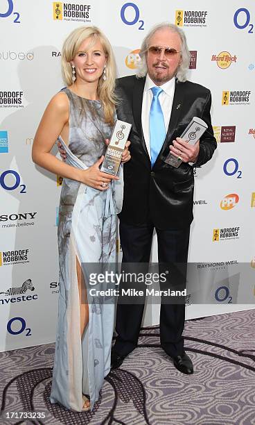 Alison Balsom and Barry Gibb attend the Nordoff Robbins Silver Clef Awards at London Hilton on June 28, 2013 in London, England.