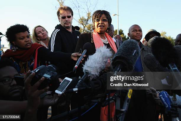 Former wife of Nelson Mandela Winnie Madikizela-Mandela speaks to the press outside Nelson Mandela House in Soweto on June 28, 2013 in Johannesberg,...