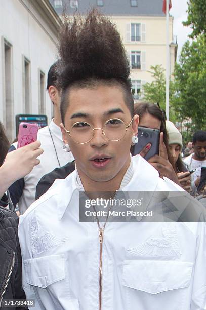 Singer Tae-Yang is seen leaving the Kris Van Assche fashion show at 'Palais de Tokyo' on June 28, 2013 in Paris, France.