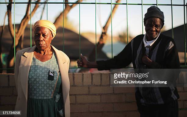People wait for news outside the Mediclinic Heart Hospital where Nelson Mandela is being treated on June 28, 2013 in Pretoria, South Africa. People...