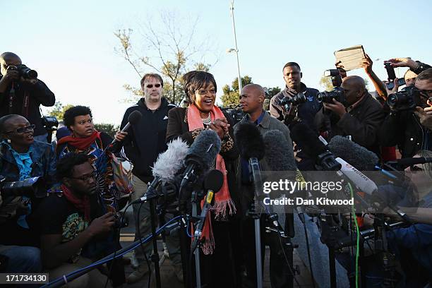 Former wife of Nelson Mandela Winnie Madikizela-Mandela speaks to the press outside Nelson Mandela House in Soweto on June 28, 2013 in Johannesberg,...