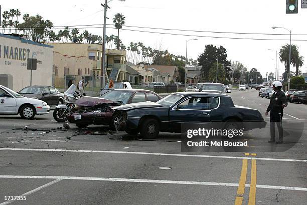 Two cars crash after police officers block a street to allow actress Jennifer Lopez to pass through after filming a driving scene for her upcoming...