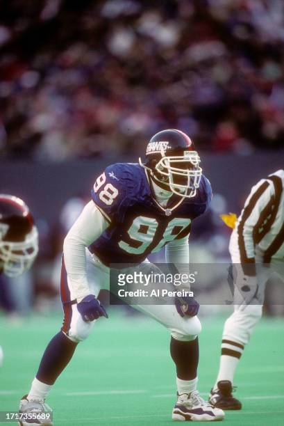Outside Linebacker Jessie Armstead of the New York Giants follows the action in the game between the New England Patriots vs the New York Giants on...