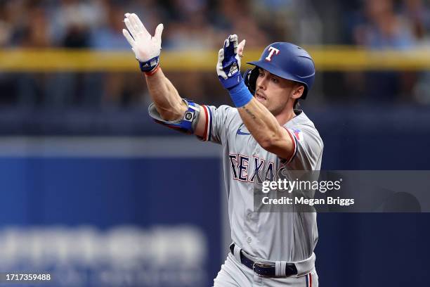 Evan Carter of the Texas Rangers rounds the bases after hitting a two-run home run in the fourth inning against the Tampa Bay Rays during Game Two of...