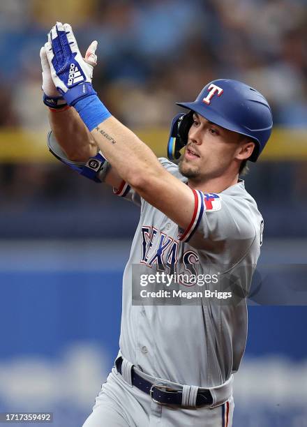 Evan Carter of the Texas Rangers rounds the bases after hitting a two-run home run in the fourth inning against the Tampa Bay Rays during Game Two of...