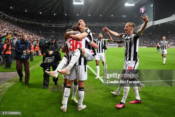 Sean Longstaff of Newcastle United celebrates with Miguel Almiron of Newcastle United after scoring the team's third goal during the UEFA Champions...