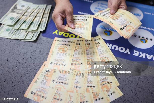 Hawthorne, CA Most people paid cash for their Powerball plays, but debit cards are also accepted at Blue Bird Liquor in Hawthorne, CA, Tuesday, Oct....