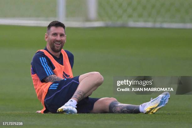 Argentina's forward Lionel Messi laughs during a training session in Ezeiza, Buenos Aires, on October 10 ahead of FIFA World Cup 2026 qualifier...