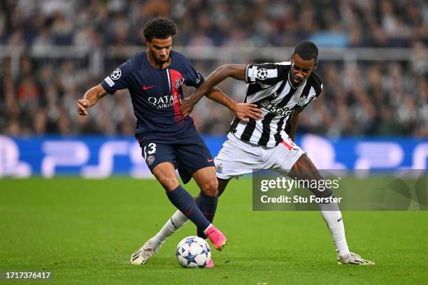 Warren Zaire-Emery of Paris Saint-Germain and Alexander Isak of Newcastle United compete for the ball during the UEFA Champions League match between...