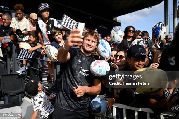 Ethan Blackadder of the All Blacks poses for photos with fans at Matmut Stadium ahead of their Rugby World Cup France 2023 match against Uruguay at...