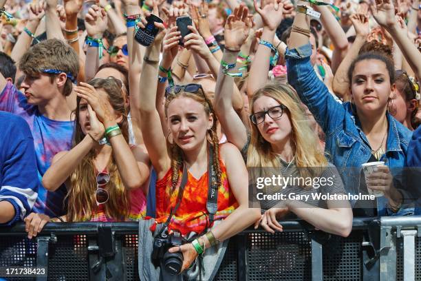 Festival goers enjoy the atmosphere during Day 2 of Glastonbury Festival at Worthy Farm on June 28, 2013 in Glastonbury, England.