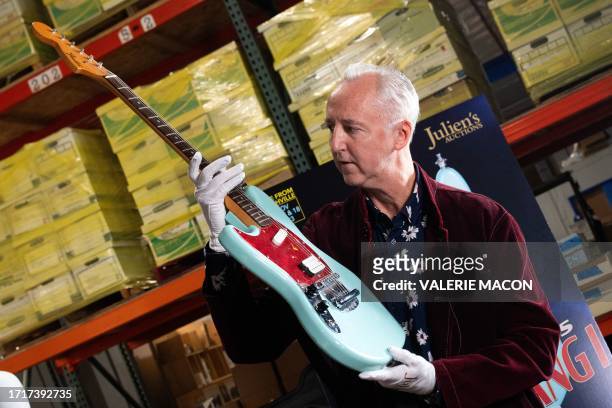 Martin Nolan, Executive Director, Chief Financial Officer, and a principal of Julien's Auctions shows Kurt Cobain's Skystang I guitar during the...
