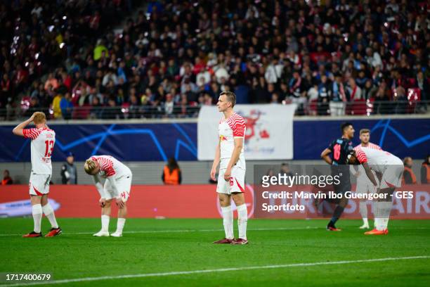 Nicolas Seiwald, Xaver Schlager, Lukas Klostermann of Leipzig looks dejected after 2nd goal against Leipzig during the UEFA Champions League match...