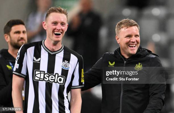 Sean Longstaff of Newcastle United and Eddie Howe, Manager of Newcastle United, celebrate victory at full-time following the UEFA Champions League...