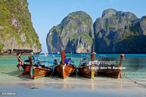 boats at maya bay, phi phi ley. - phi phi island stock pictures, royalty-free photos & images