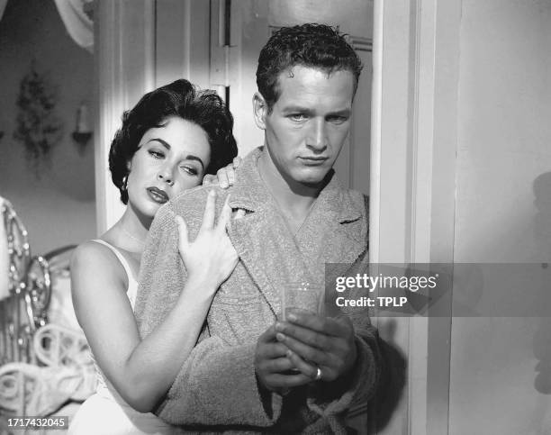 View of actors Elizabeth Taylor and Paul Newman in a scene from the film 'Cat on a Hot Tin Roof' , 1958.