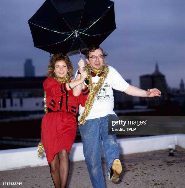 Portrait of television weather forecasters Trish Williamson and Ian McCaskill , London, England, December 14, 1988.