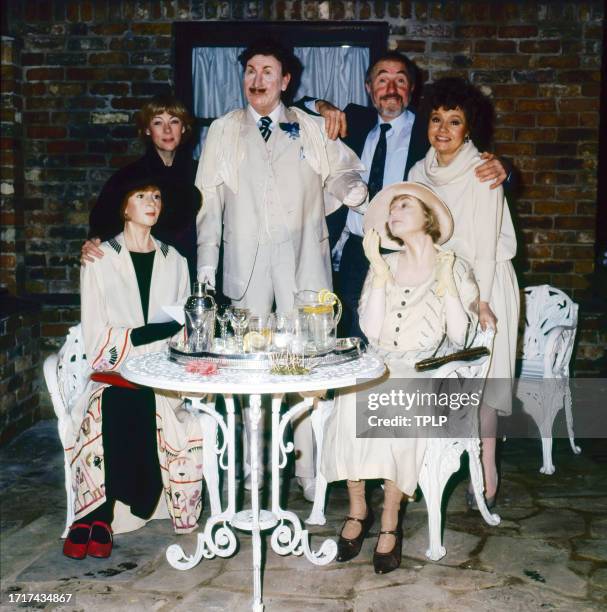 Portrait of, from left, British actors Geraldine McEwan , Nigel Hawthorne , and Prunella Scales, they pose with wax figures of their characters in...