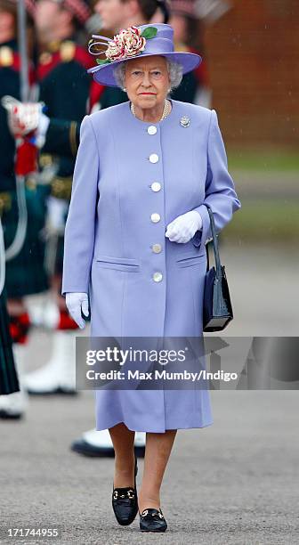 Queen Elizabeth II inspects troops of the Argyll & Sutherland Highlanders, 5th Battalion, Royal Regiment of Scotland during a visit to Howe Barracks...