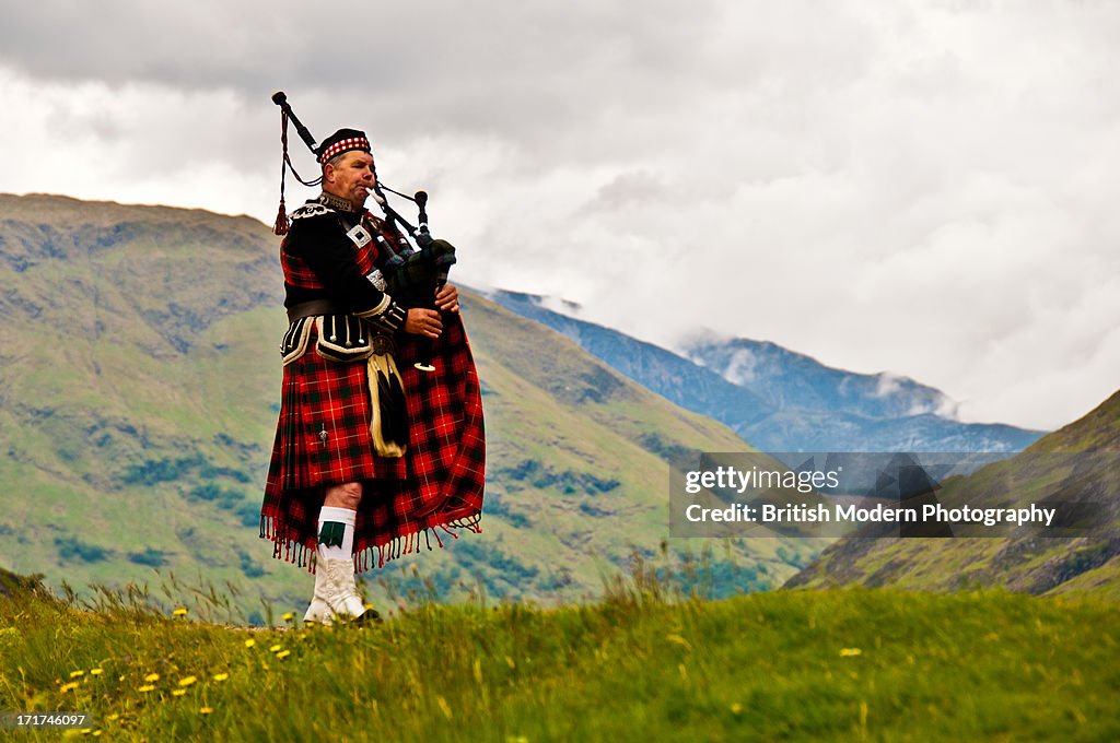 Highland bagpiper in kilt