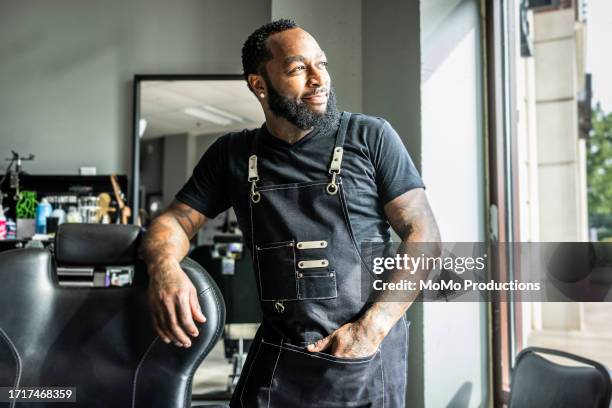 portrait of proud barbershop owner in his shop - businessman haircut stock pictures, royalty-free photos & images
