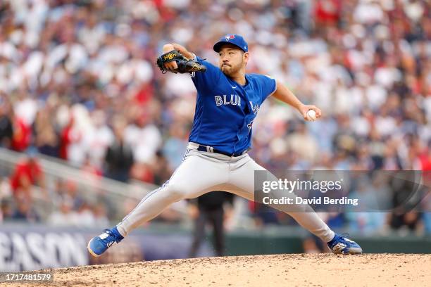 Yusei Kikuchi of the Toronto Blue Jays throws a pitch against the Minnesota Twins during the fourth inning in Game Two of the Wild Card Series at...