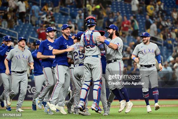 The Texas Rangers celebrate after defeating the Tampa Bay Rays 7-1in Game Two of the Wild Card Series at Tropicana Field on October 04, 2023 in St...