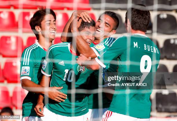 Mexico's Jesus Corona celebrates with team mates after scoring a goal during a group stage football match between Mali and Mexico at the FIFA Under...