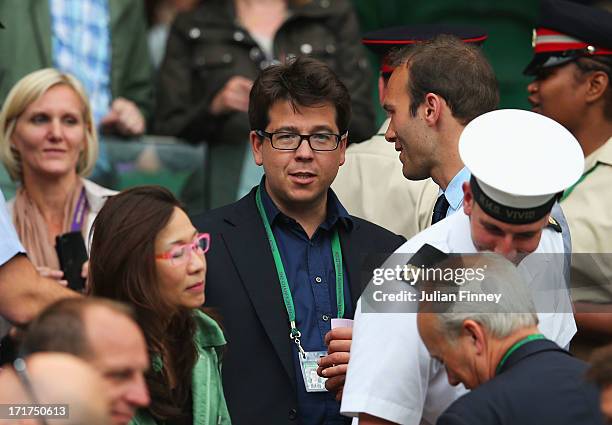 Comedian Michael McIntyre and Ross Hutchins chat prior to the Gentlemen's Singles third round match between Tommy Robredo of Spain and Andy Murray of...