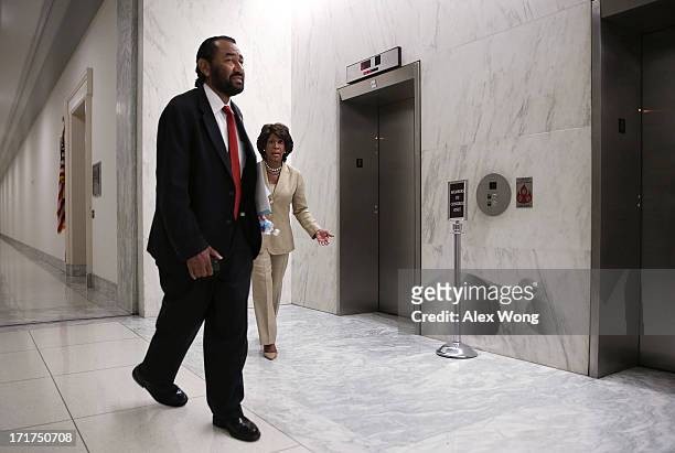 Rep. Maxine Waters and Rep. Al Green leave for a vote during a discussion June 28, 2013 on Capitol Hill in Washington, DC. Rep. Waters held the...