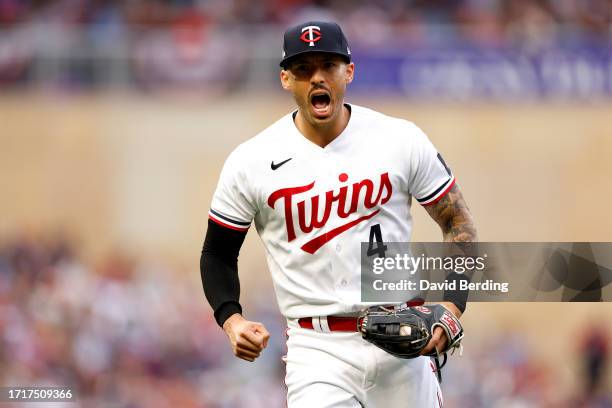 Carlos Correa of the Minnesota Twins celebrates after tagging out Vladimir Guerrero Jr. #27 of the Toronto Blue Jays at second base during the fifth...