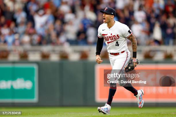 Carlos Correa of the Minnesota Twins celebrates after tagging out Vladimir Guerrero Jr. #27 of the Toronto Blue Jays at second base during the fifth...