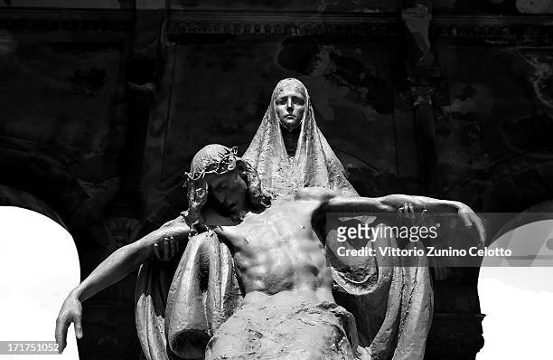 Statue is diplayed at Milan's Monumental Cemetery on April 24, 2013 in Milan, Italy. Milans Monumental Cemetery or Cimitero Monumentale is one of the...