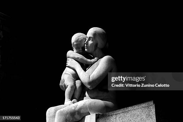 Statue is diplayed at Milan's Monumental Cemetery on April 24, 2013 in Milan, Italy. Milans Monumental Cemetery or Cimitero Monumentale is one of the...