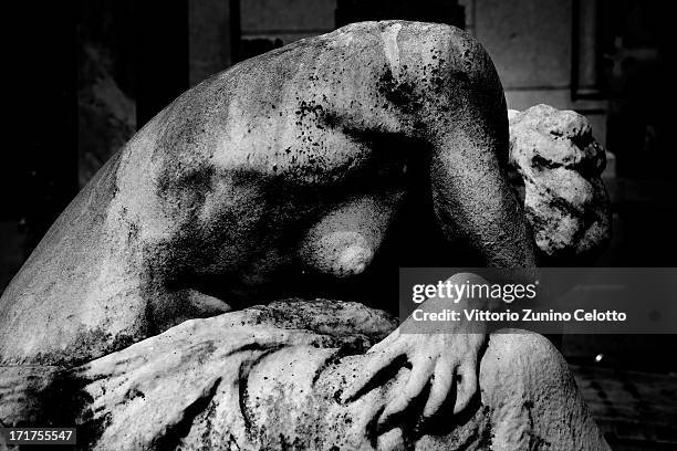 Statue is diplayed at Milan's Monumental Cemetery on April 24, 2013 in Milan, Italy. Milans Monumental Cemetery or Cimitero Monumentale is one of the...