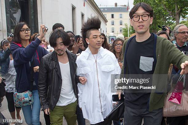 Singer Tae-Yang is seen leaving the Kris Van Assche fashion show at 'Palais de Tokyo' on June 28, 2013 in Paris, France.