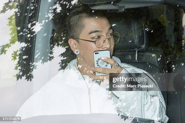 Singer Tae-Yang is seen leaving the Kris Van Assche fashion show at 'Palais de Tokyo' on June 28, 2013 in Paris, France.