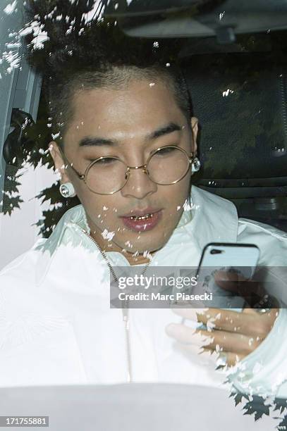 Singer Tae-Yang is seen leaving the Kris Van Assche fashion show at 'Palais de Tokyo' on June 28, 2013 in Paris, France.