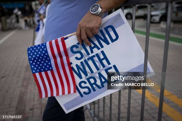 People attend the Israel Solidarity Rally organized by the Greater Miami Jewish Federation at the Holocaust Memorial in Miami Beach, Florida, on...