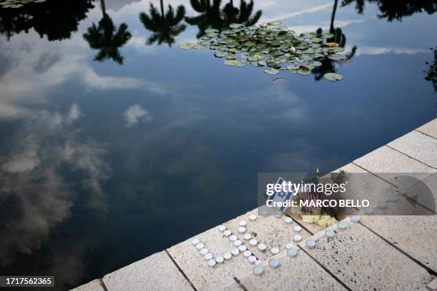 Israel and American flags are seen as people attend the Israel Solidarity Rally organized by the Greater Miami Jewish Federation at the Holocaust...