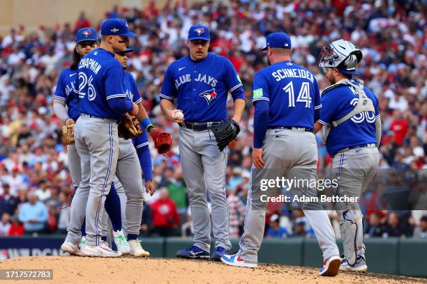 John Schneider of the Toronto Blue Jays takes out Erik Swanson against the Minnesota Twins during the seventh inning in Game Two of the Wild Card...