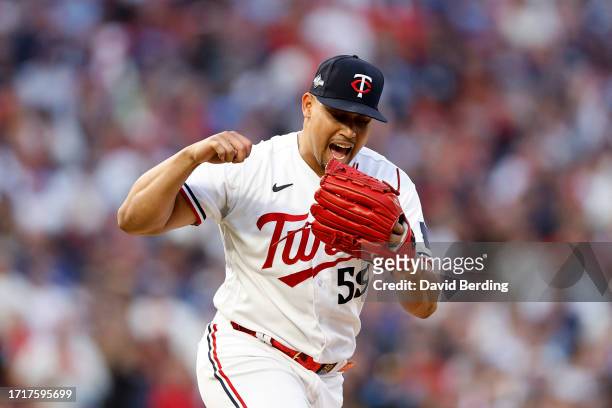 Jhoan Duran of the Minnesota Twins celebrates a strike out against the Toronto Blue Jays during the ninth inning in Game Two of the Wild Card Series...