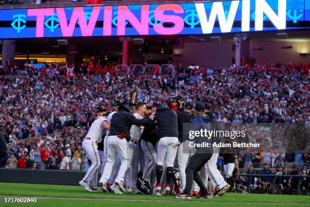 The Minnesota Twins celebrate after defeating the Toronto Blue Jays in Game Two to win the Wild Card Series at Target Field on October 04, 2023 in...