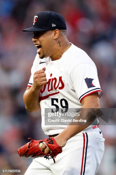 Jhoan Duran of the Minnesota Twins celebrates after defeating the Toronto Blue Jays in Game Two to win the Wild Card Series at Target Field on...