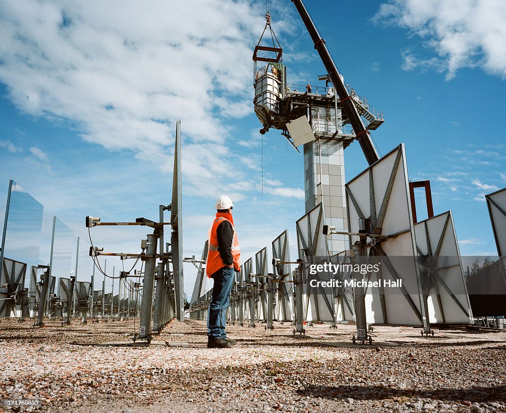 Workman at solar thermal research facility