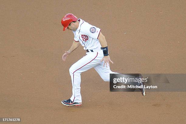 Steven Lombardozzi of the Washington Nationals runs to third base during a baseball game against the Colorado Rockies on June 21, 2013 at Nationals...