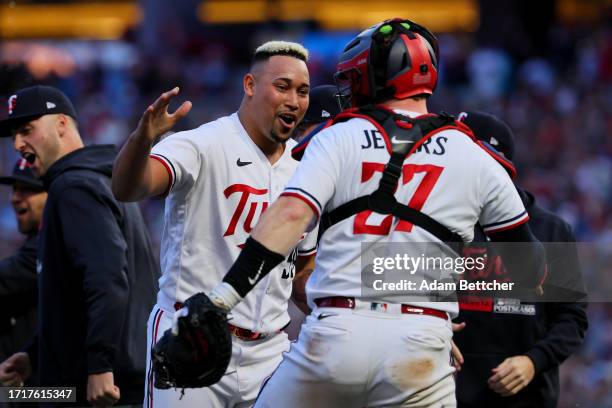 Jhoan Duran and Ryan Jeffers of the Minnesota Twins celebrate after defeating the Toronto Blue Jays in Game Two to win the Wild Card Series at Target...