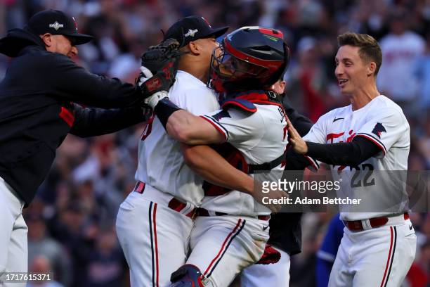 Jhoan Duran and Ryan Jeffers of the Minnesota Twins celebrate after defeating the Toronto Blue Jays in Game Two to win the Wild Card Series at Target...